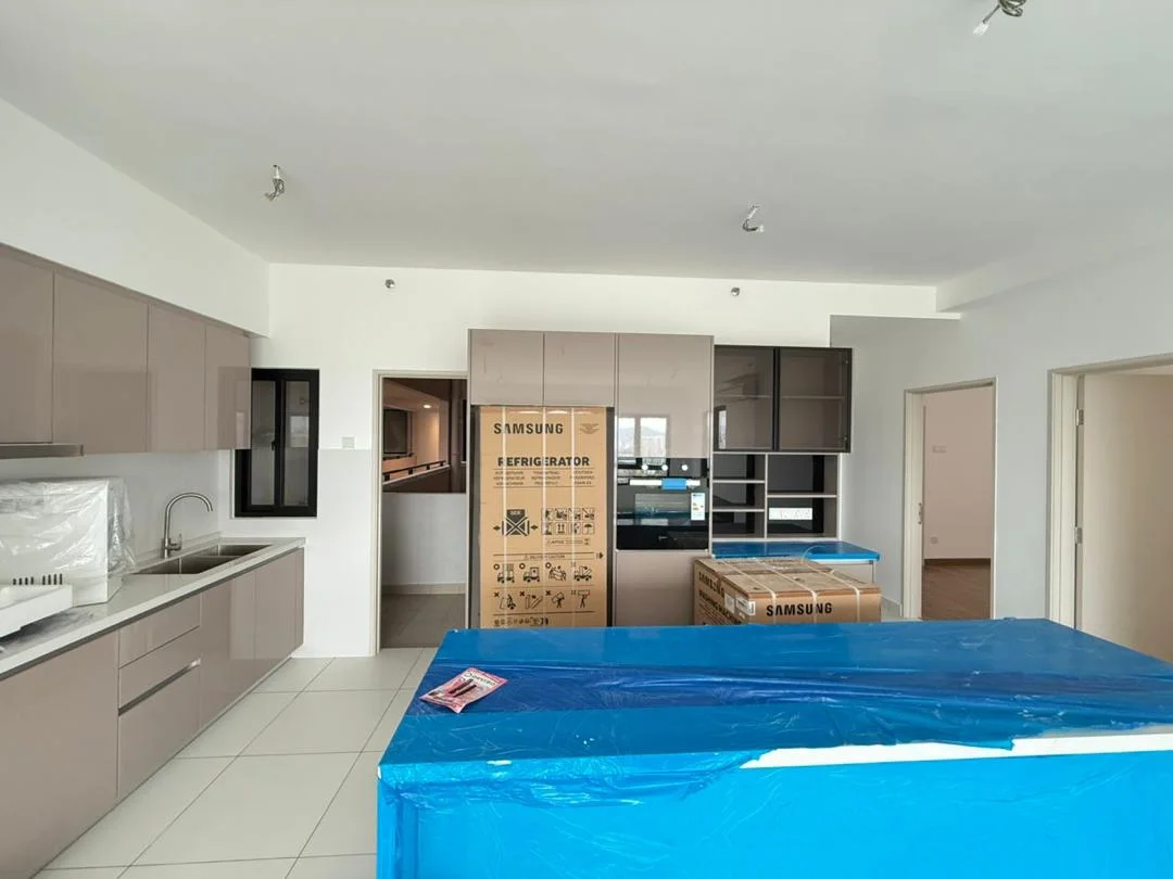 Kitchen features: light grey cabinetry, white countertop, stainless-steel sink, chrome pull-down faucet, built-in oven, stainless-steel fridge, kitchen island with blue protective cover, ceramic tile flooring, recessed downlights, open layout, wall-mounted cabinets, pantry space, floor-to-ceiling windows, neutral wall colour; style: modern.